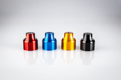 Four Santoro Fabworx Cadillac crash bar wheel mounts in red, blue, gold and black on a white background