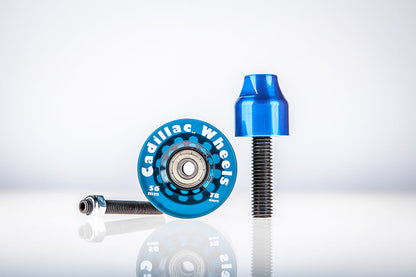 Blue Santoro Fabworx Cadillac crash bar wheel with blue mount and bolt on a reflective surface