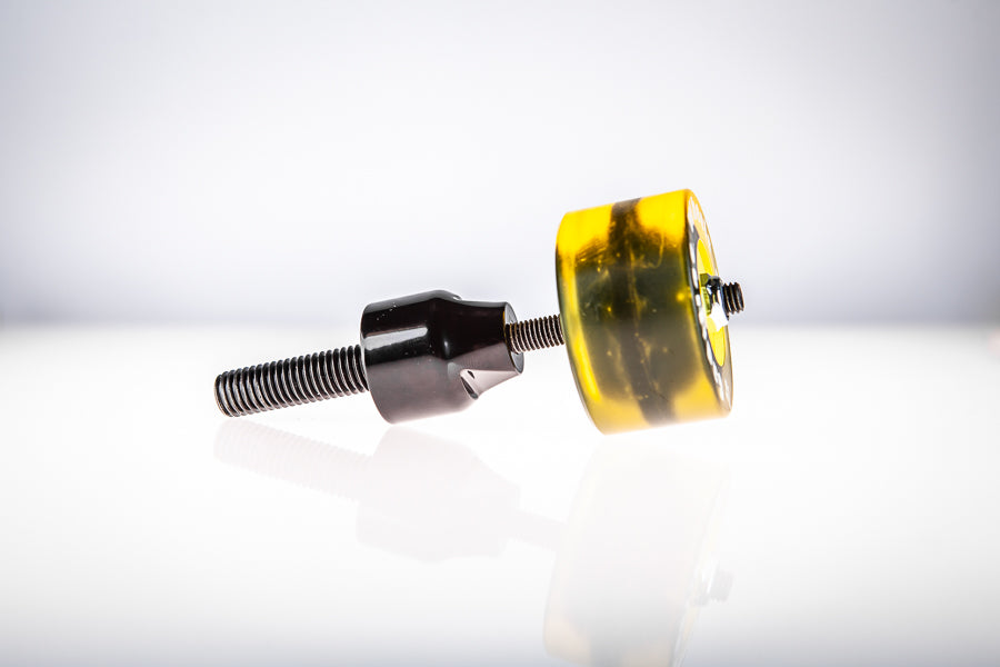 Yellow Santoro Fabworx Cadillac crash bar wheel with black mount and bolt, side view on a white background